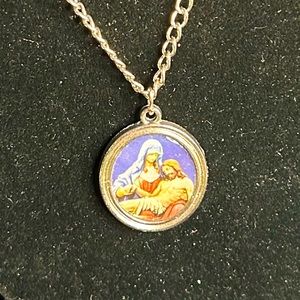 Unbranded Silver tone Metal Mary and Jesus pendant necklace.
